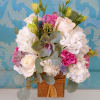 Our designer will create a beautiful bouquet in a Wood tone container