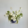 A fresh mix of green and white blooms arranged in an elegant