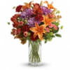 Brighten any fall day with this colorful array! Gorgeous orange lilies arranged