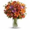 Brighten any fall day with this colorful array! Gorgeous orange lilies arranged