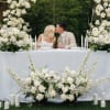 A breathtaking wedding set featuring a graceful floral arch and a refined
