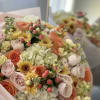 A warm and radiant bouquet of peach roses, golden chrysanthemums, soft blush