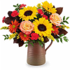 Featuring cheerful sunflowers, rich warm fall tones, this stunning seasonal bouquet sits