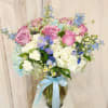 This large elegant bouquet is designed with a mix of white and