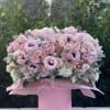 Adorable box with mix of pink flowers