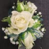  
Spray roses make up this wrist corsage. In the special instructions