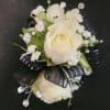  
Spray roses make up this wrist corsage. In the special instructions
