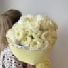 A dreamy bouquet of garden roses in delicate vanilla tones, as s