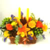 This centerpiece is a rectangular design of mixed fall flowers in a