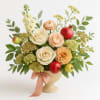 A low, elegant Rosh Hashanah arrangement in honey, cream, and blush with