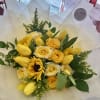 Composition of premium roses with lush floral accents. Elegantly wrapped in our