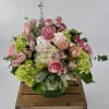 Delight in a stunning blend of green and white hydrangea, pink ranunculus