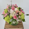 Green Hydrangea, Cymbidium Orchids, Spray Roses are arranged in a 6x6&quot; leaf