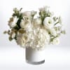 The Pure Grace Bouquet is a stunning all-white arrangement designed to embody