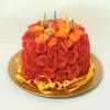 A fresh and beautiful fresh flower cake of assorted flowers and candles.
