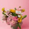 Hydrangeas and mixed blooms in ceramic pot.