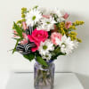 This arrangement is the perfect way to celebrate spring or any occasion!