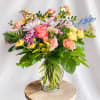 Farm fresh flowers in glass vase giving that just picked vibe. Product