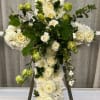 This dramatic cross all in white conveys love and faith.
Roses, mums, lisianthus