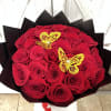 A stunning display of  2 Dozen passionate red roses, each symbolizing