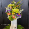 Made with fresh cut autumn colored flowers, this bouquet will definitely &quot;Raise