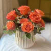Beautiful premium orange roses in a 6&quot; textured white ceramic container.