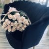 A Blush Pink Rose Bouquet, elegantly wrapped in wrapping paper and tied