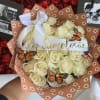 A stunning bouquet of pristine white roses wrapped in a warm clay-brown