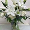 This fragrant arrangement includes fluffy hydrangeas, fragrant Oriental lilies, eucalyptus and Dusty