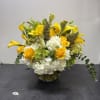 Bright and uplifting, this arrangement combines vibrant yellow calla lilies, golden roses