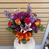 Mixed cut with purple daisies, purple stock, high and magic roses, stargazer
