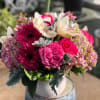 A stunning display of pink Gerbera daisies,  Pink Garden roses, pink
