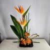 This impressive tropical arrangement is stunning! Unique and appropriate for multiple occasions.
