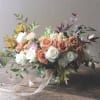 Send this sophisticated neutral color blooms with gorgeous Toffee roses gathered in