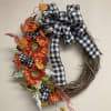 20&rdquo; grapevine wreath, bright and colorful with buffalo check ribbon.
Bright orange sunflowers