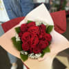 A dozen long stem red roses with baby&#039;s breath with assorted greenery