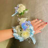 Made from fresh flowers, a corsage looks like a petite flower arrangement