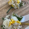 Made from fresh flowers, a corsage looks like a petite flower arrangement