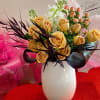 Cappuccino roses paired with other white blooms,berries and dark foilages.Finished off with