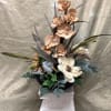 A hand crafted silk arrangement  centerpiece set in a modern black