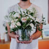 Blushing, whimsical arrangement with greenery