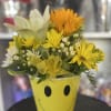 fresh mix flowers in happy face vase 