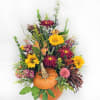A Pumpkin Fall Arrangement with a real pumpkin for the container! 
