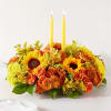 Enjoy a candlelit dinner with this colorful arrangement that embraces every shade