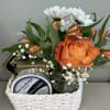 Imagine a charming small flower and snack gift basket, a delightful combination
