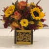 Beautiful assortment of fresh flowers designed with the cozy feeling of autumn.