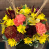 A beautiful display of traditional autumn colors designed with long lasting flowers.