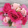 This corsage is a combo of light pink and hot pink on