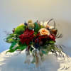 A lovely mix of textures: warm peach roses, rich burgundy mums, earthy