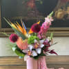This exquisite tropical bouquet captures the essence of paradise with its vibrant